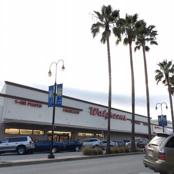 Walgreens - cars parked in front of a walmart store - Drugstores Near Me - Millbrae, California