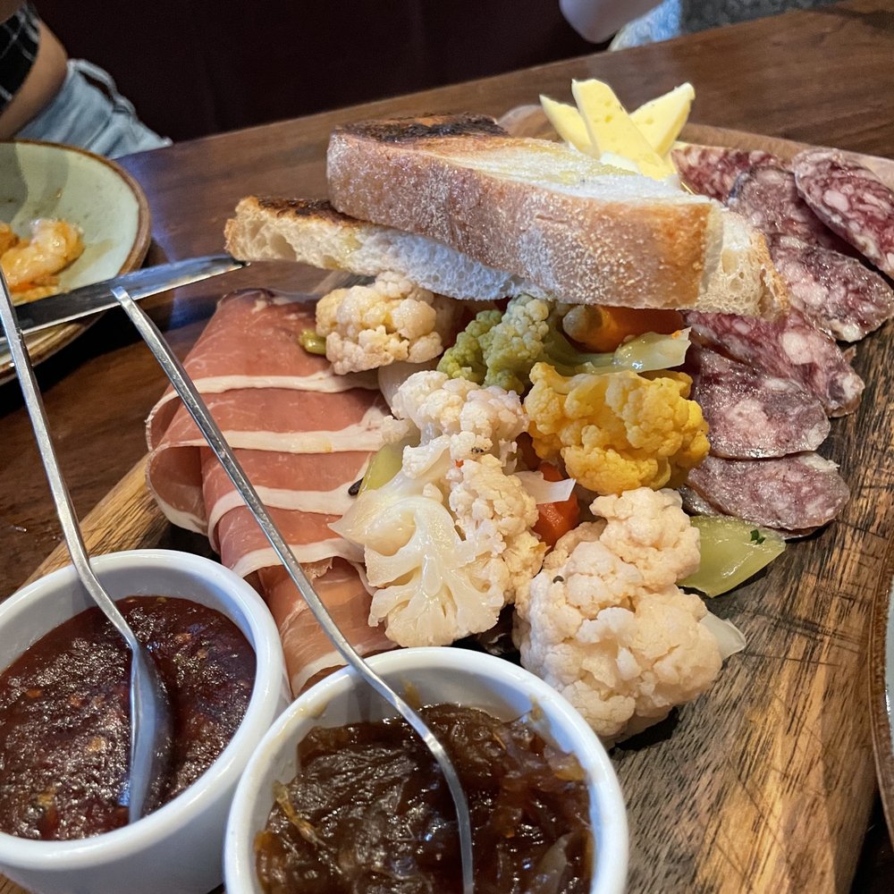 Gypsy Kitchen - cheese board w/jamon serrano, spanish sausage, manchego, and mahon. Also comes with bread, pickled veggies (cauliflower, celery, carrots) - Spanish Near Me - Atlanta, Georgia Gypsy Kitchen - cheese board w/jamon serrano, spanish sausage, manchego, and mahon. Also comes with bread, pickled veggies (cauliflower, celery, carrots) - Spanish Near Me - Atlanta, Georgia