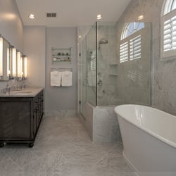D R Hartman Construction - Full bathroom conversion. Soaking tub, enlarged walk in shower with bench, double sink. All walls and flooring in marble.