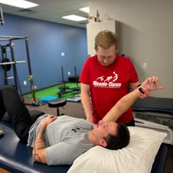 Grand Oaks Sports Medicine and Rehabilitation - PT assessing ROM following frozen shoulder diagnosis