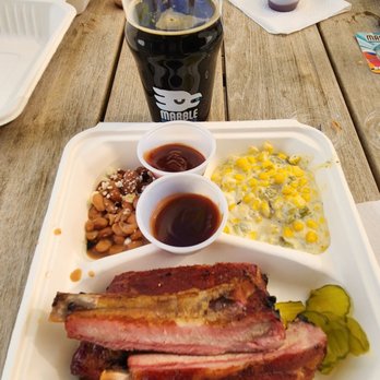 Tantrum Barbecue - BBQ ribs plate, including pinto beans, spicy cream corn, and their Sweet/Spicy & Tantrum sauces. - Food Trucks Near Me - Albuquerque, New Mexico