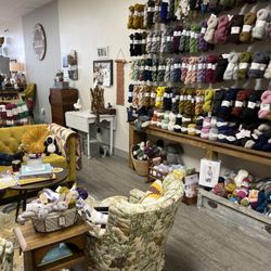 Growing Up Lulu Fiber Arts - Yarn wall and cozy sitting area