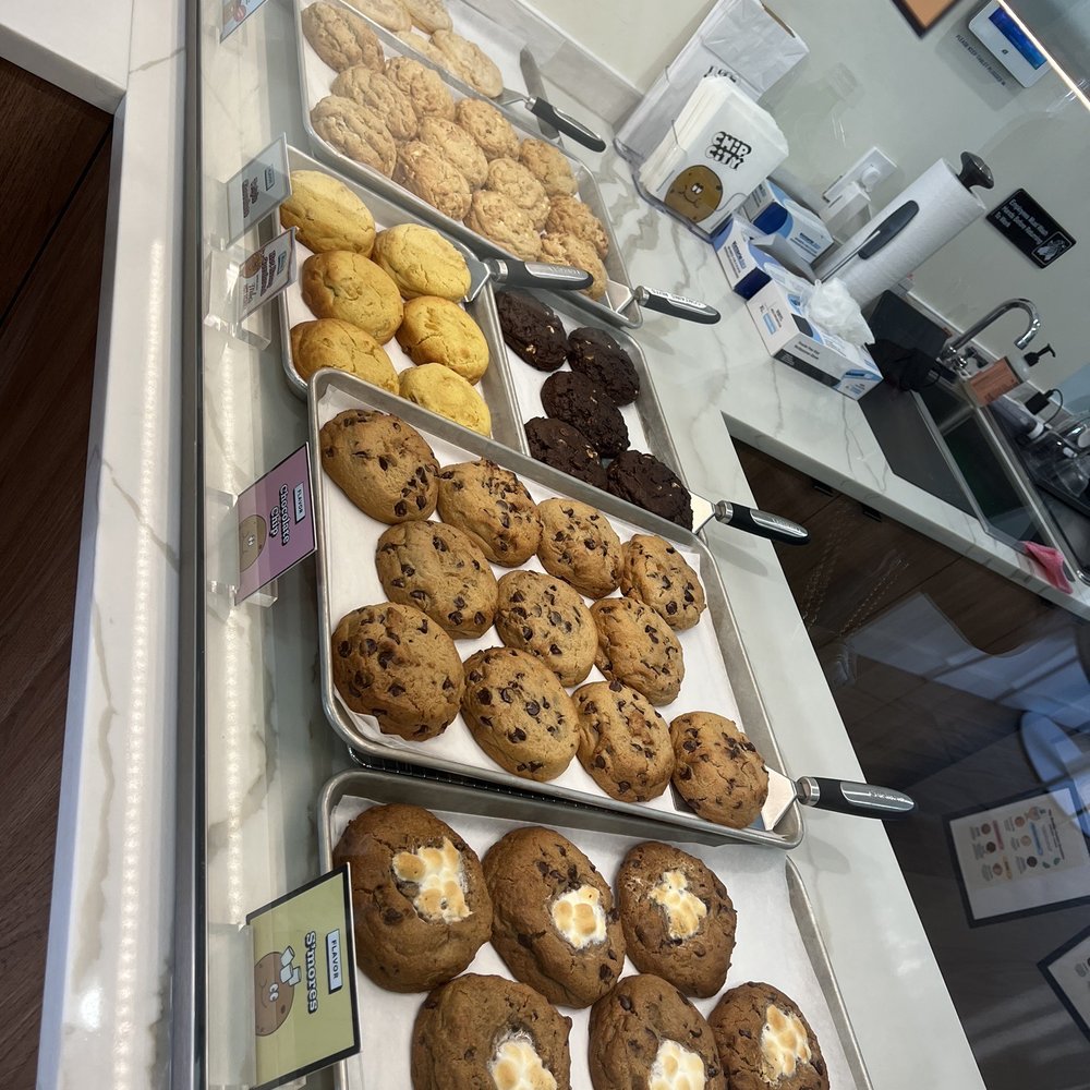 a display of cookies and pastries a display of cookies and pastries
