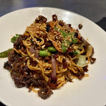 Yard House - Spicy beef garlic noodles with gochujang - New American Near Me - Springfield, Virginia Yard House - Spicy beef garlic noodles with gochujang - New American Near Me - Springfield, Virginia