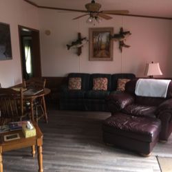 Caddo Lake Lodge & Caboose - Lodge Living room with a lake view out french doors