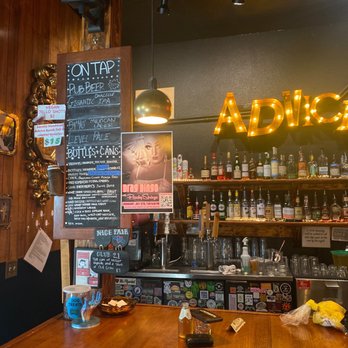 Advice Booth - a wooden bar with a chalkboard menu - Bars Near Me - Portland, Oregon