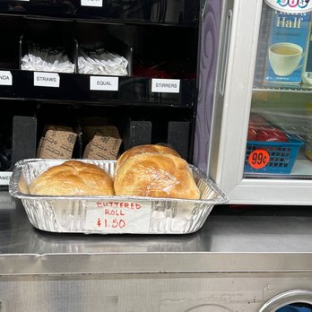Quick Stop - a tray of bread in front of a refrigerator - Convenience Stores Near Me - Leonardo, New Jersey