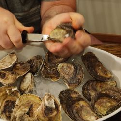 Chipman's Wharf - Shucking fresh oysters