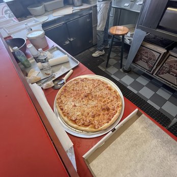 Eddie D's Pizzeria - a pizza on a table - Pizza Near Me - Valley Stream, New York