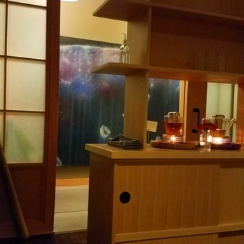 Root Whole Body - View from the tea room toward the entrance, with the glowing tea lights under the pots. - Yoga Near Me - Portland, Oregon Root Whole Body - View from the tea room toward the entrance, with the glowing tea lights under the pots. - Yoga Near Me - Portland, Oregon