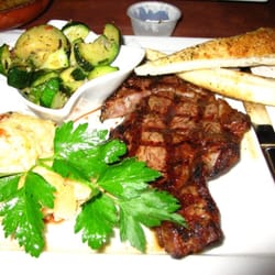 Craftsman Chop Company - Thursday special $8.99 Rib-eye (8oz) with cheesy scalloped potatoes & sauteed zucchini.