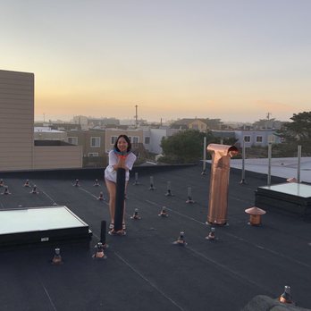 UL Roofing - Finished roof with copper vents, flashings, bronze skylights, and solar roof mounts. - Roofing Near Me
