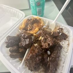 Scotchies Jerk Center - Oxtail, white rice, & max n cheese.