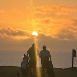 Golfers by the bay