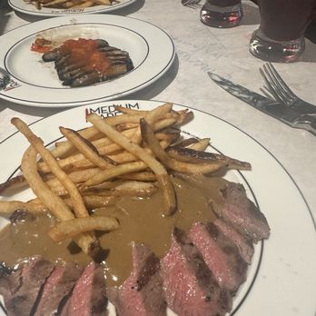Medium Rare - Steak frites entree, Grilled Portobello and Fire Roasted Red Pepper Sauce - Steakhouses Near Me - Columbia, Maryland Medium Rare - Steak frites entree, Grilled Portobello and Fire Roasted Red Pepper Sauce - Steakhouses Near Me - Columbia, Maryland
