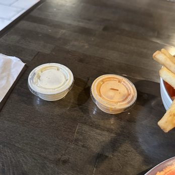 Peri Peri Original - Container of Garlic Pepper Sauce and N&S Signature Sauce.  I was offered more sauce, but this was plenty. - Salad Near Me - Arlington, Virginia