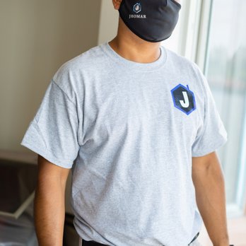 Jhomar Developments - a man wearing a face mask - General Contractors Near Me