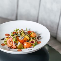 Privé249 - Heirloom tomato salad with black garlix, white anchovy, olive and caper gel, fresh herbs and EVO