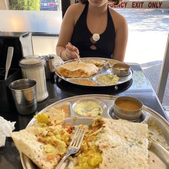 Madras Cafe - Onion rava dosa mine with cashews and raisins, hers without. - Indian Near Me - Sunnyvale, California Madras Cafe - Onion rava dosa mine with cashews and raisins, hers without. - Indian Near Me - Sunnyvale, California