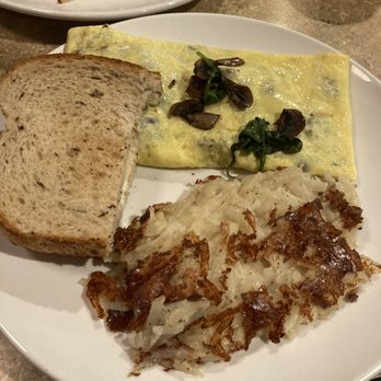 Cafe Madison - Yummy mushroom, spinach and Swiss cheese omelette with cheesy hash browns and rye toast - Breakfast & Brunch Near Me - Albany, New York Cafe Madison - Yummy mushroom, spinach and Swiss cheese omelette with cheesy hash browns and rye toast - Breakfast & Brunch Near Me - Albany, New York