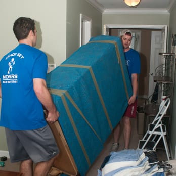 Ready Set Movers - RSM crew moving a dresser wrapped up in a heavy duty furniture pad. - Movers Near Me - MOUNT PLEASANT, South Carolina Ready Set Movers - RSM crew moving a dresser wrapped up in a heavy duty furniture pad. - Movers Near Me - MOUNT PLEASANT, South Carolina