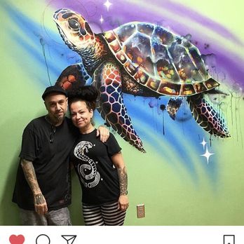 True Love Tattoo - Cjay & Jessica in front of the sea turtle done for the kids at the Charlotte Behavioral Center in Punta Gorda. - Tattoo Near Me - Punta Gorda, Florida True Love Tattoo - Cjay & Jessica in front of the sea turtle done for the kids at the Charlotte Behavioral Center in Punta Gorda. - Tattoo Near Me - Punta Gorda, Florida