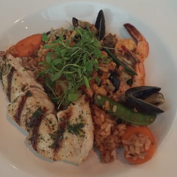 Nino's - Red Fish with Paella special $36. - Italian Near Me - Baton Rouge, Louisiana