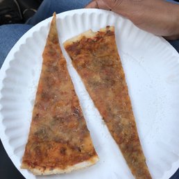 That's what you get for $4! Note how dry the pizza is so it is beguiling to curl up