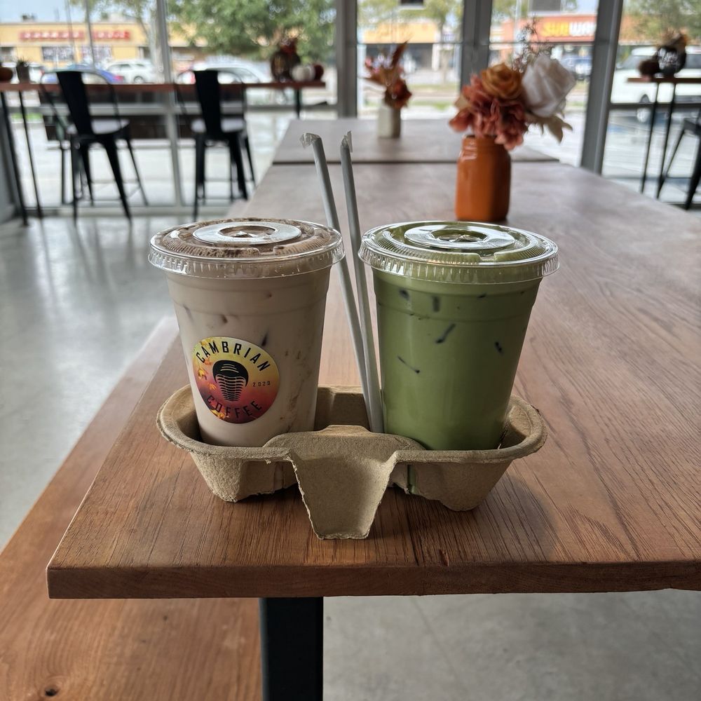 Cambrian Coffee - iced chai latte with vanilla (left) and iced matcha latte with oat milk and vanilla (right) - Coffee & Tea Near Me - Houston, Texas Cambrian Coffee - iced chai latte with vanilla (left) and iced matcha latte with oat milk and vanilla (right) - Coffee & Tea Near Me - Houston, Texas