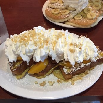 Eggs 'n Things - Waikiki Beach Eggspress - My French toast and my wife's pancakes in the back. Serving size is really big - Breakfast & Brunch Near Me - Honolulu, Hawaii