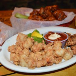 Can't decide? Dive into a delicious dilemma! Which will you choose to pair with your ice-cold beer: fiery Hot Wings or exotic Gatorbite