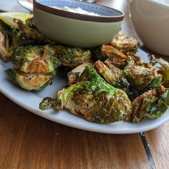 East End Vine - a plate of brussels sprouts and a bowl of yogurt - Tapas/Small Plates Near Me - Toronto, Ontario