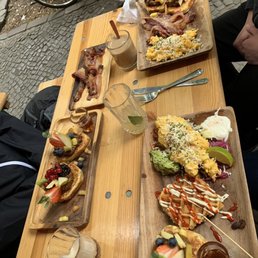 Left: pancakes and bacon Upper: scrambled eggs, pancakes, bacon Right: mixed plate