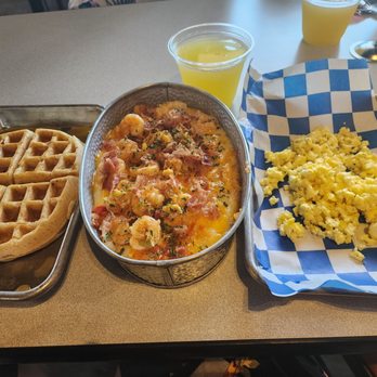 TaterQue - Seafood trio and grits with a waffle and eggs - Barbeque Near Me - Pflugerville, Texas