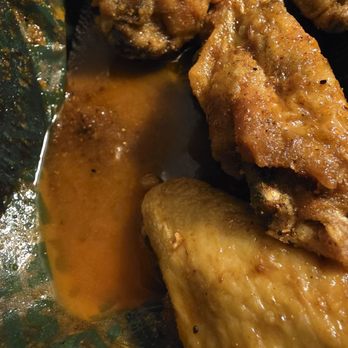 Wingstop - Gross puddle of grease that is seasoned but not the wings - Chicken Wings Near Me - Southaven, Mississippi