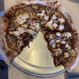 Wood fired bbq pizza. Too much sauce. Messy.