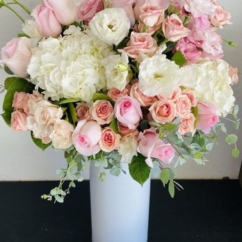 The Bloom Shoppe - A bouquet of pink and white roses, hydrangeas, and lisianthus arranged in a tall white vase. - Florists Near Me - Temecula, California