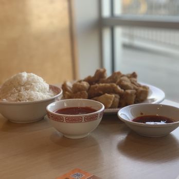 Happy Dragon - a table with bowls of food and rice - Chinese Near Me - New Braunfels, Texas Happy Dragon - a table with bowls of food and rice - Chinese Near Me - New Braunfels, Texas