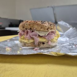 Jersey Gurlz Subs N More - Pictured is a deli ham, egg, and cheese sandwich on a freshly toasted everything bagel.