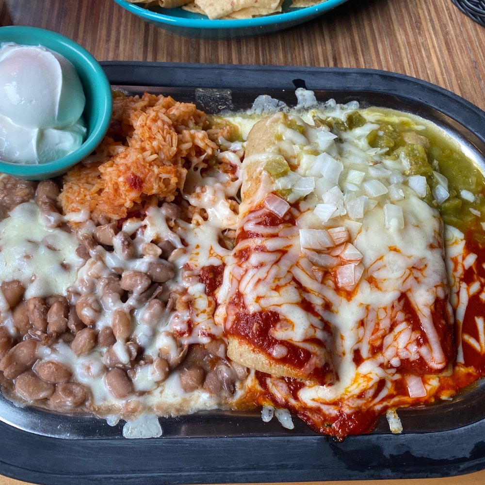Tomasita's - Two rolled enchiladas, rice and beans add sour cream. Because it's hot gringo! - New Mexican Cuisine Near Me - Santa Fe, New Mexico Tomasita's - Two rolled enchiladas, rice and beans add sour cream. Because it's hot gringo! - New Mexican Cuisine Near Me - Santa Fe, New Mexico