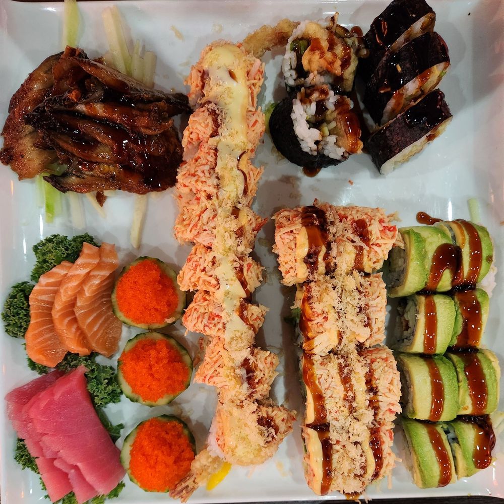 Tuna, salmon, flying fish roe, and eel sashimi. The rolls were sushi boss, dragon, red dragon and spider. Tuna, salmon, flying fish roe, and eel sashimi. The rolls were sushi boss, dragon, red dragon and spider.