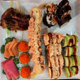 Tuna, salmon, flying fish roe, and eel sashimi. The rolls were sushi boss, dragon, red dragon and spider.