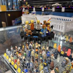 Custom Minifigs displayed on a wooden gear