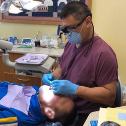 Dan B Hilo, DDS - Dr Dan Hilo doing an examination to diagnose and care for a patient