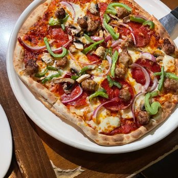 Stoney's - a pizza on a white plate - Bars Near Me - Washington, DC, District of Columbia