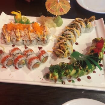 Sushiya - Top left-TNT, top right-green chili, bottom left- spicy salmon, bottom right-caterpillar - Asian Fusion Near Me - Albuquerque, New Mexico Sushiya - Top left-TNT, top right-green chili, bottom left- spicy salmon, bottom right-caterpillar - Asian Fusion Near Me - Albuquerque, New Mexico