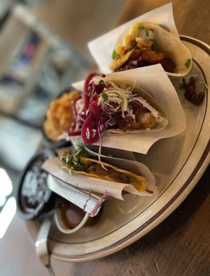 Photo of Los Chingones - RiNo - Denver, CO, US. three tacoss on a plate