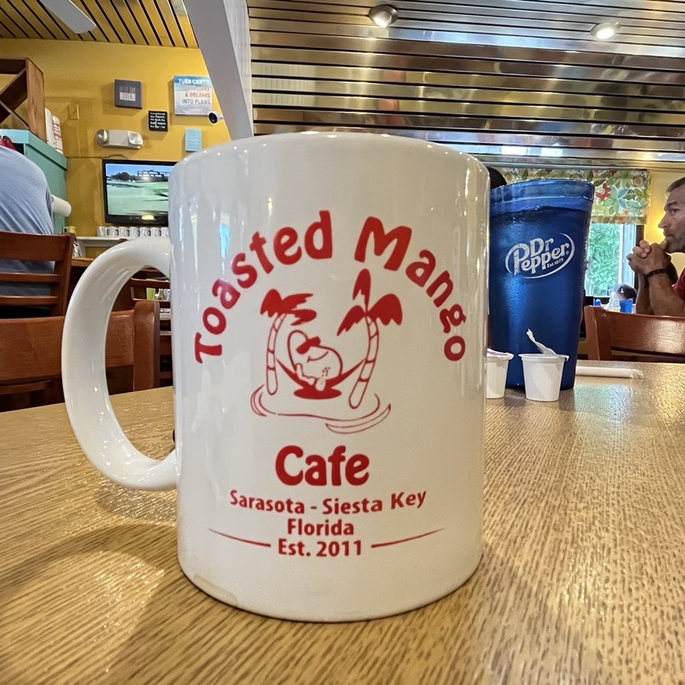 Toasted Mango Cafe - Coffee mug - Cafes Near Me - Sarasota, Florida Toasted Mango Cafe - Coffee mug - Cafes Near Me - Sarasota, Florida