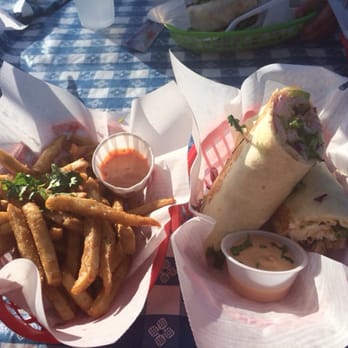 Cali N Tito's - Fried fish burrito with a side of fries. Both yummy! - Latin American Near Me - Athens, Georgia Cali N Tito's - Fried fish burrito with a side of fries. Both yummy! - Latin American Near Me - Athens, Georgia