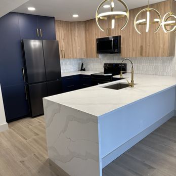 America Remodeling - a kitchen with a large island - General Contractors Near Me - Coconut Creek, Florida